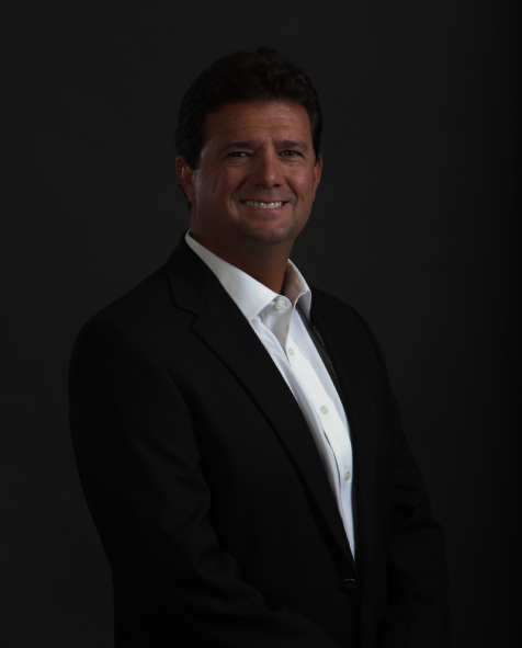 A full picture of Bob Brillante in a suit